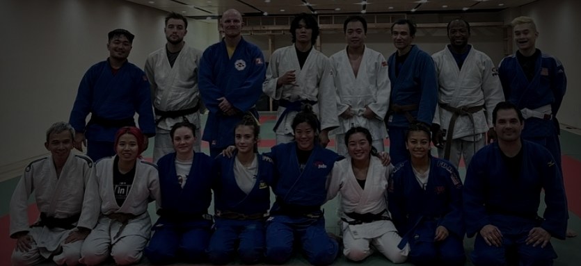 Judoka executing a throw during training at San Diego Judo